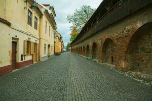 Medieval street with historical buildings in the heart of Romania. Sibiu the eastern European citadel city. Travel in Europe photo