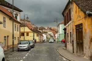 Medieval street with historical buildings in the heart of Romania. Sibiu the eastern European citadel city. Travel in Europe photo