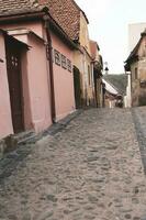 A beautiful medieval citadel city of Sighisoara in the heart of Romania, Transylvania travel destination in Eastern Europe. photo