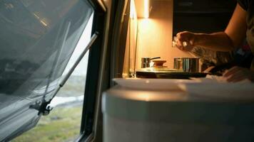 RV Owner Preparing Hot Tea While on RV Camping. Camper Van Interior. video