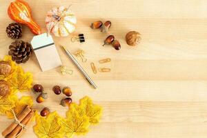 Thanksgiving With Pumpkins, gifts And greeting On Wooden Table. Fall Background. photo