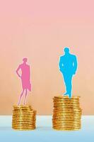 Conceptual image of gender inequality. A women and a men with income difference. photo