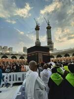 Mecca, Saudi Arabia, June 2023 - Pilgrims from different countries around the world perform Tawaf in the courtyard of Masjid Al Haram, Mecca in the evening. photo