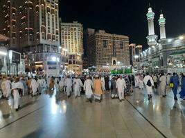 Mecca, Saudi Arabia, June 2023 - At night, there is a large number of pilgrims from all over the world in the outer courtyard of Masjid Al Haram. photo