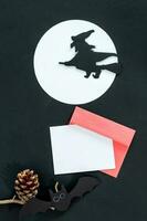 Blank white halloween card with witch and moon. Poster invitation mockup photo