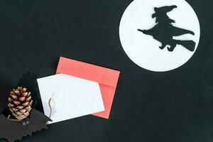 Halloween party, witch, moon, bat. Design of a holiday invitation card, postcard. photo