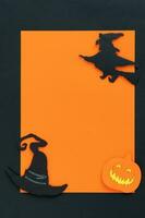 happy halloween background with witch and witch hat. photo