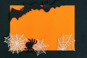 Halloween decorations on orange background. Halloween concept. Flat lay, top view, copy space. photo