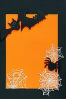 Halloween decorations on orange background. Halloween concept. Flat lay, top view, copy space. photo