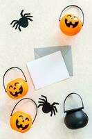 Blank white halloween card with pumpkins and spiders. Banner invitation mockup. photo