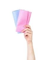 Man's arm raised holding a shammy cloth. Hygiene concept. Isolate on white background. photo