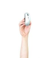 Man's arm raised holding a PC mouse. Technology concept. Isolate on white background. photo