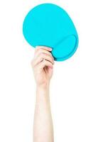 Man's arm raised holding a mouse pad. Technology concept. Isolate on white background. photo