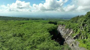 Aerial view of the valley and the paths of Mount Merapi's lava in Yogyakarta, Indonesian volcano video