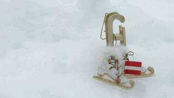 Wooden made mini sleighs and Austrian flag in the snow. video
