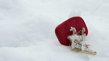 Winter sport equipment and first aid kit in the snow video