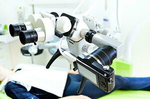 The image of the professional Dental endodontic binocular microscope. photo