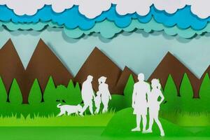 Family and couple walking in a park. Paper art. Paper craft. Paper cut. Handmade. photo