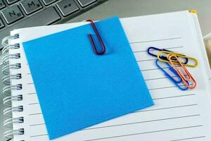 Office desk table with keyboard, supplies and notebook. photo