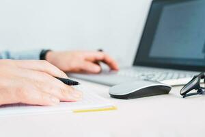 Businessmen hands using laptop on desk. photo