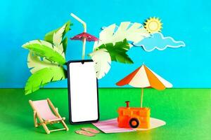 Tropical vacation and travel season banner. Mobile phone with blank screen. photo