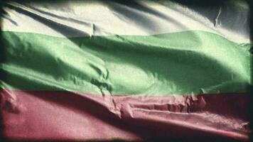 Retro aged Bulgaria flag waving on the wind. Old vintage Bulgarian banner swaying on the breeze. Seamless loop. video