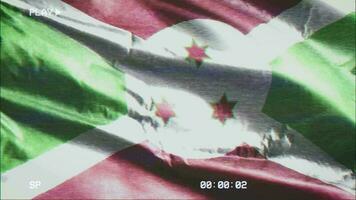 VHS video casette record Burundi flag waving on the wind. Glitch noise with time counter recording Burundian banner swaying on the breeze. Seamless loop.