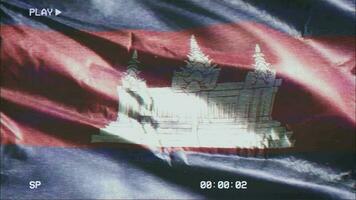 VHS video casette record Cambodia flag waving on the wind. Glitch noise with time counter recording Cambodian banner swaying on the breeze. Seamless loop.