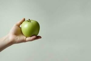 hand holding green apple with copy space. ai generated photo