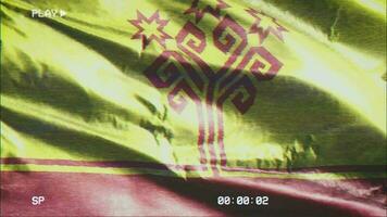 VHS video casette record Chuvashia flag waving on the wind. Glitch noise with time counter recording Chuvash banner swaying on the breeze. Seamless loop.