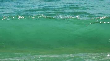 Turquoise waves rolled on the beach of Koh Miang island, Similan Islands, slow motion video