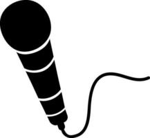 Microphone with cable glyph icon. vector