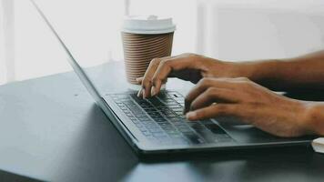 Portrait of Asian young female working on laptop at office video