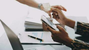 Women holding credit card and using smartphones at home.Online shopping, internet banking, store online, payment, spending money, e-commerce payment at the store, credit card, concept video