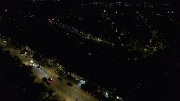 Aerial View of Luton Town of England During Night. Drone's Camera Footage Captured on May 28th, 2023. Illuminated Houses and Road with Traffic. Night Aerial View of British Town video