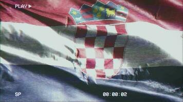 VHS video casette record Croatia flag waving on the wind. Glitch noise with time counter recording Croatian banner swaying on the breeze. Seamless loop.