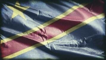 retro envelhecido democrático república do a Congo bandeira acenando em a vento. velho vintage bandeira balançando em a brisa. desatado laço. video
