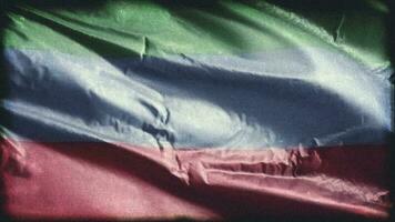Retro aged Dagestan flag waving on the wind. Old vintage banner swaying on the breeze. Seamless loop. video