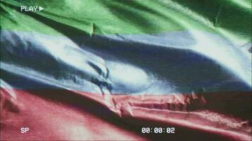 VHS video casette record Dagestan flag waving on the wind. Glitch noise with time counter recording banner swaying on the breeze. Seamless loop.