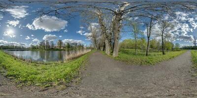 full seamless spherical 360 hdri panorama view on pedestrian walking path among poplar grove with clumsy branches near lake in equirectangular projection with , ready VR AR content photo