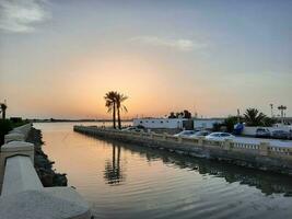 Jeddah, Saudi Arabia, June 2023 - A beautiful view of the sunset at Jeddah Corniche in the evening. photo