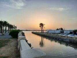 Jeddah, Saudi Arabia, June 2023 - A beautiful view of the sunset at Jeddah Corniche in the evening. photo