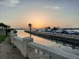 Jeddah, Saudi Arabia, June 2023 - A beautiful view of the sunset at Jeddah Corniche in the evening. photo