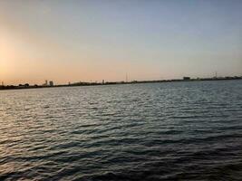 Jeddah, Saudi Arabia, June 2023 - A beautiful view of the sunset at Jeddah Corniche in the evening. photo