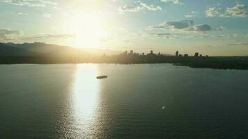 Vancouver skyline silhouettes in beautiful morning light, aerial view video