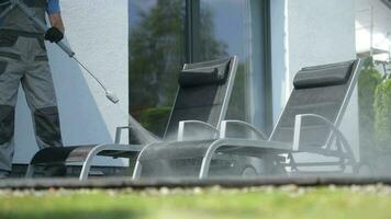 Cleaning Patio Deck Chairs Using Pressure Washer. Backyard Garden Cleaning Time. video