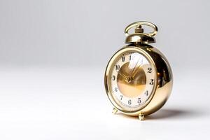 golden alarm clock on a white background. photo