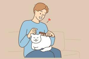 Smiling young man brushing fluffy little white cat. Happy guy take care of cute kitten. Pet ownership and friendship. Vector illustration.