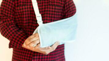 Boy in a splint, medical treatment, bone wrist rehabilitation due to falls, fractures, accidents, person. Soft focus and selective copy space for text photo