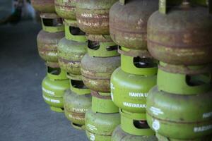 Magelang,Indoneia.25,05,2023-The 3 kg LPG cylinder produced by Pertamina is only used for the poor. green gas cylinder, LPG gas, 3kg gas, for cooking photo